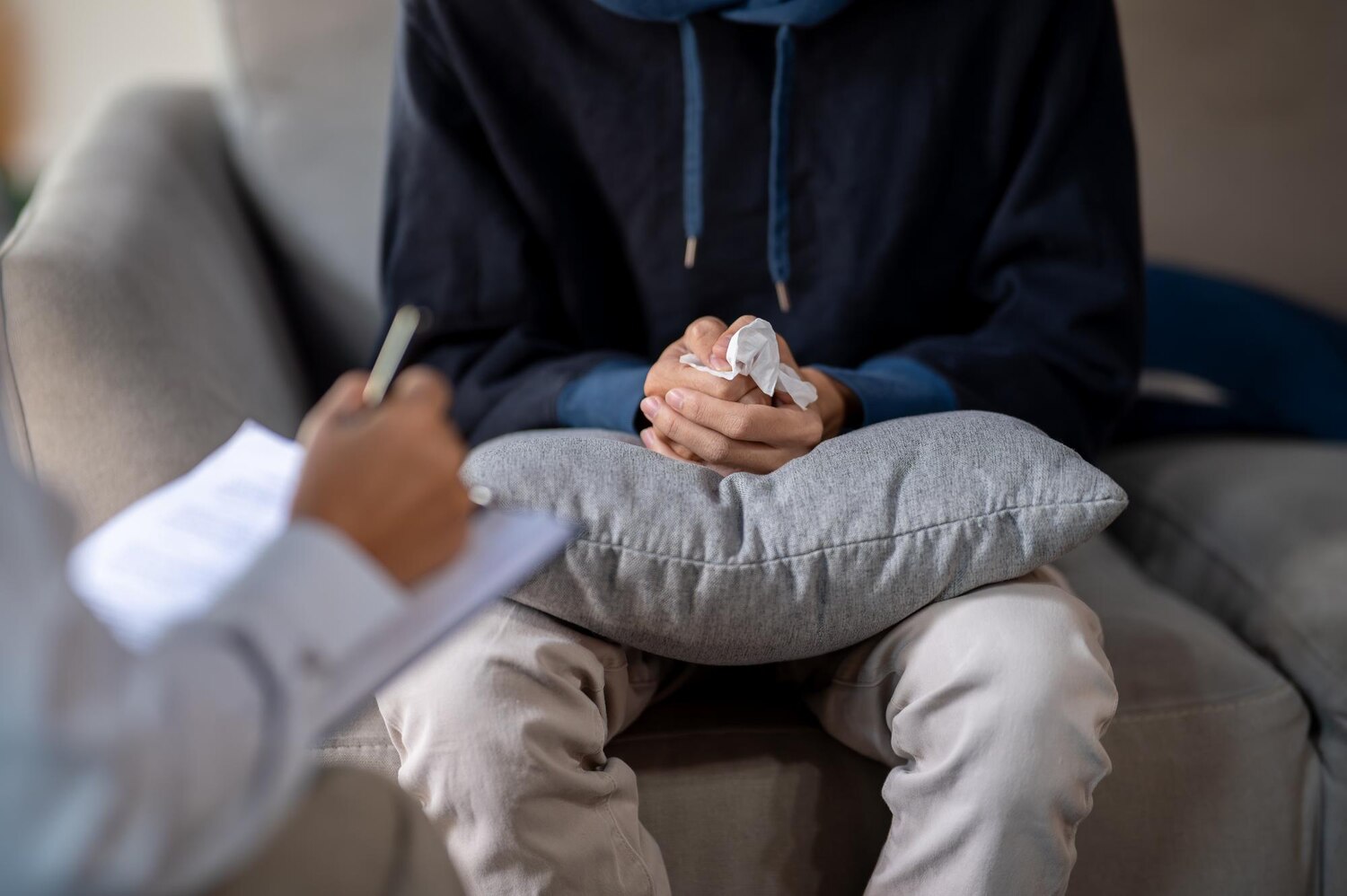 stressed man sitting sofa clasping his hands together mental health checkup 67155 54996 stressed man sitting sofa clasping his hands together mental health checkup 67155 54996