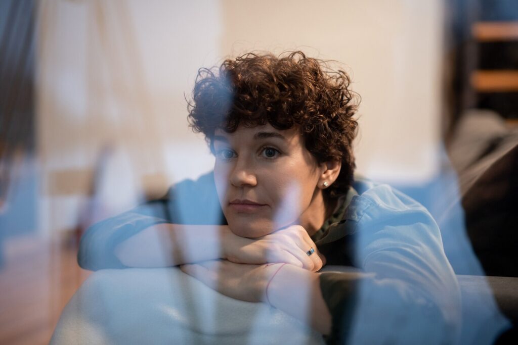young serene woman casualwear relaxing couch by window living room evening thinking something pleasant 274679 17199 young serene woman casualwear relaxing couch by window living room evening thinking something pleasant 274679 17199