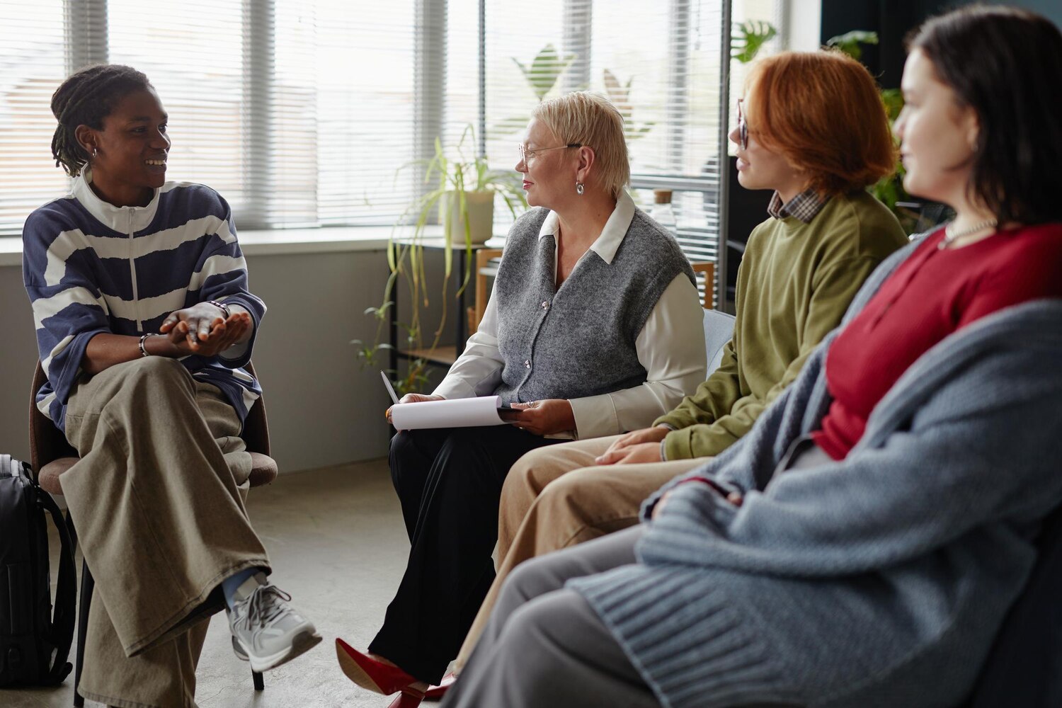 diverse group adults engaging support group discussion indoors 236854 71598 diverse group adults engaging support group discussion indoors 236854 71598