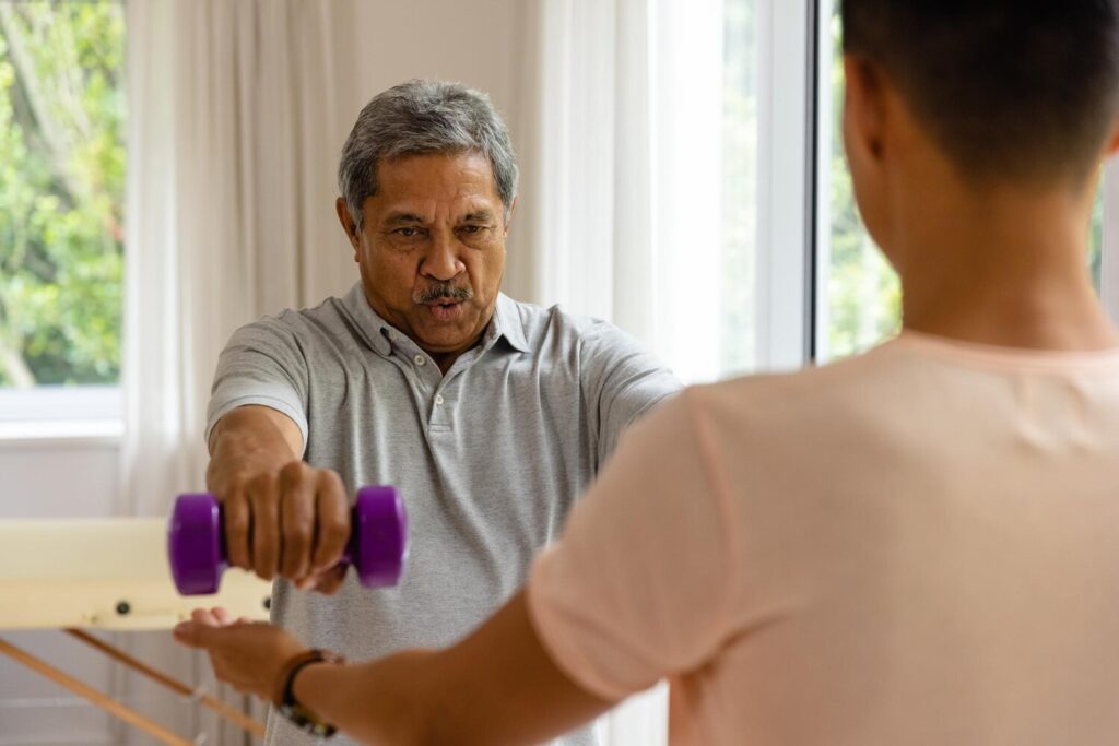 diverse male physiotherapist advising determined senior male patient using dumbbells physiotherapy healthcare wellbeing senior lifestyle unaltered 13339 339020 diverse male physiotherapist advising determined senior male patient using dumbbells physiotherapy healthcare wellbeing senior lifestyle unaltered 13339 339020